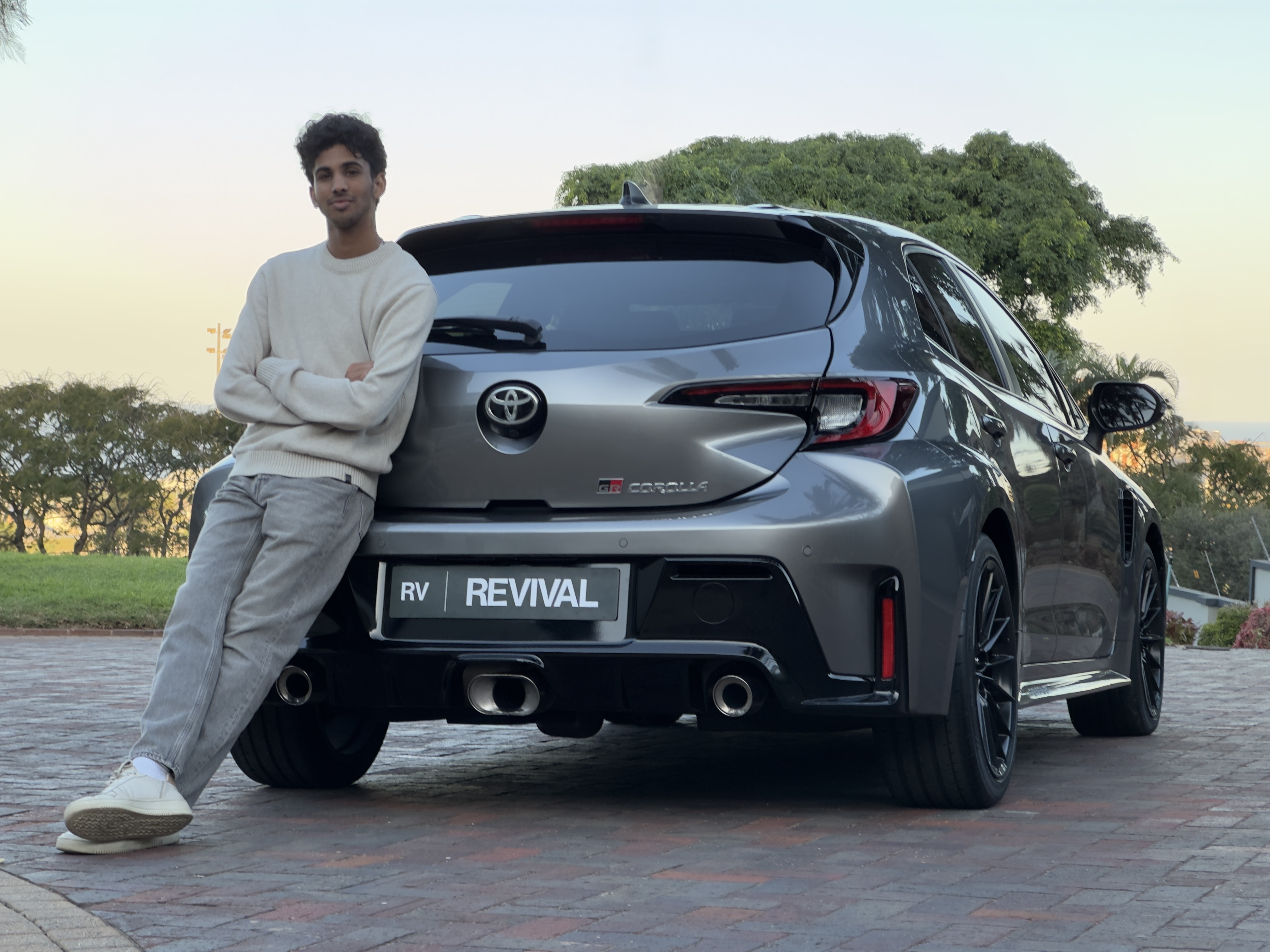 Revival Automotive presenter standing beside a Toyota GR Corolla